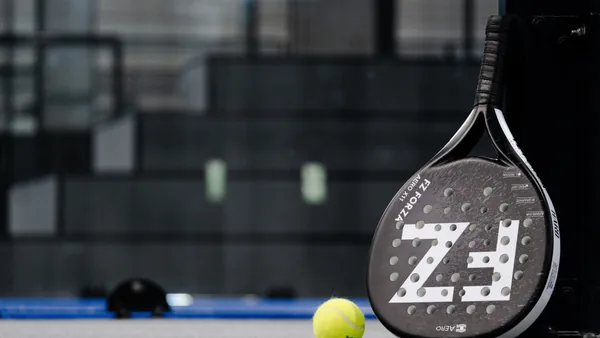 Indoor padel court with players