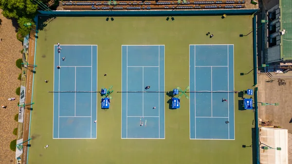Aerial view of multiple outdoor tennis courts